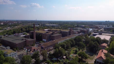 leipzig cotton spinning mill factory industrial architecture, characterized by brick buildings and a chimney