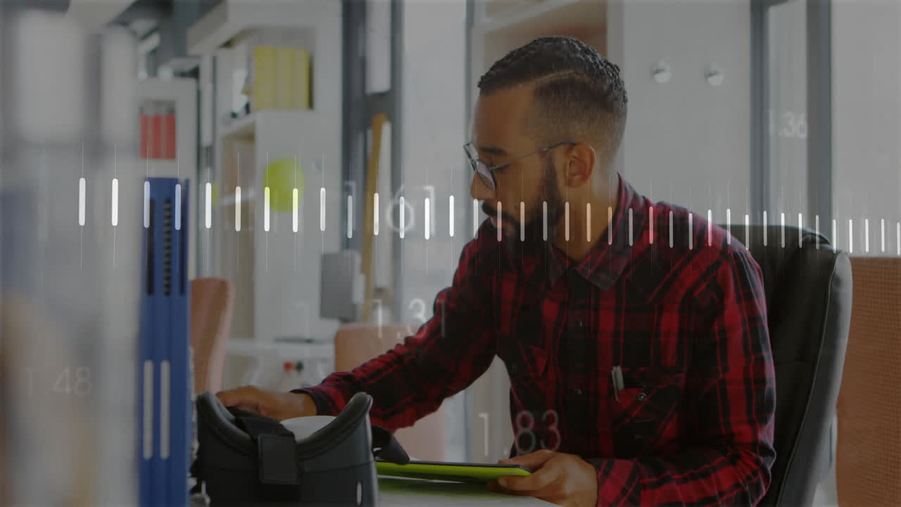 animación de procesamiento de datos y diagramas sobre hombre biracial usando tableta