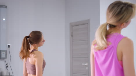 rear view of an athlete practicing a neck twist in a minimalist room, focusing on form and flexibility, with a plucked socket visible in the background