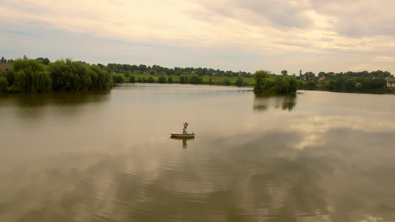 aerial view of a loving couple on a boat 07
