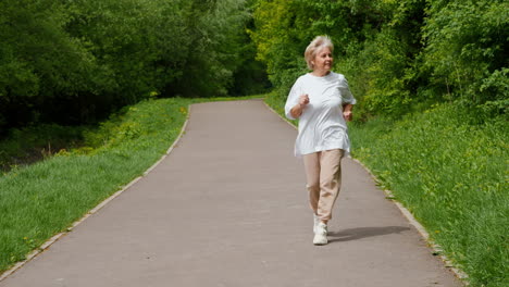 senior woman running in a park