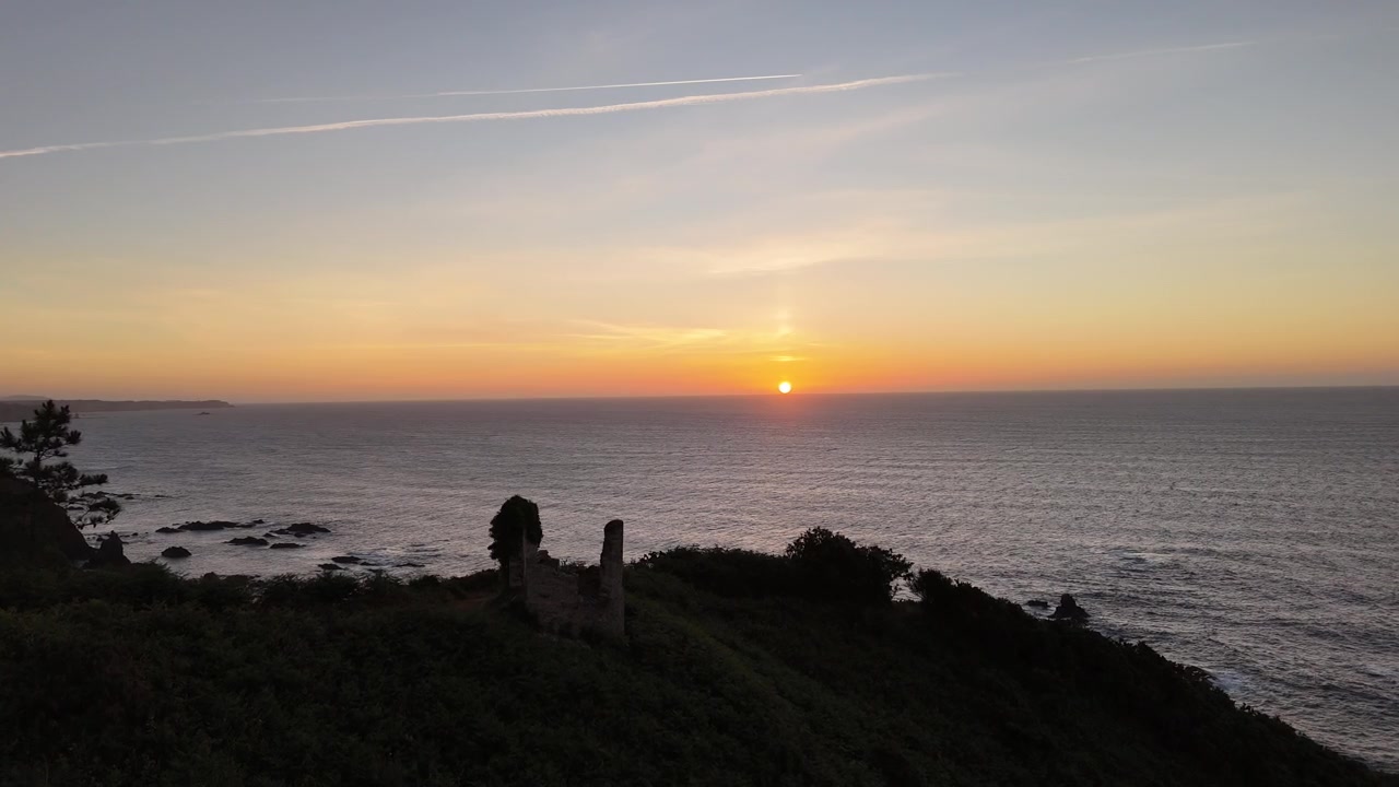 Orange sunset over the Cantabrian Sea from an Asturias cliff viewpoint
