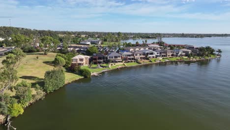 aerial approaching resort houses and apartments on lake mulwala in nsw australia