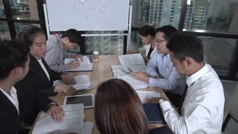 asian business people discuss marketing strategy.