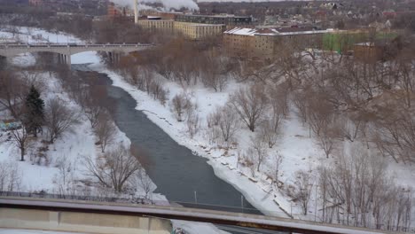 Aerial-View-of-Rushing-River-During-Winter-[4K