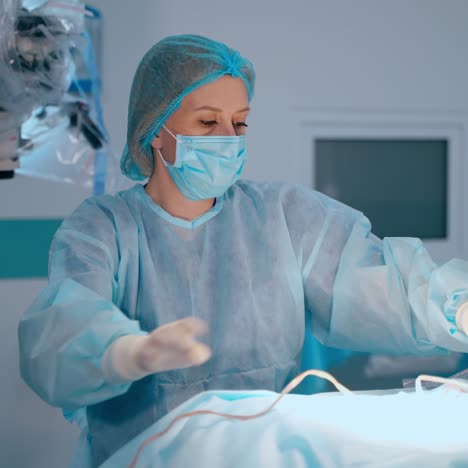doctor's assistant in medical uniform. nurse giving the doctor tubes and medical instruments in the operating room in hospital.