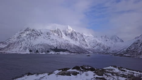 Aerial-shot-over-mountains-in-winter,-Lofoten-Islands,-Norway