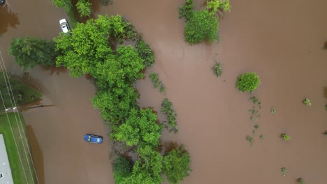 flooded cars submerged under water due to historic natural disaster caused by climate change