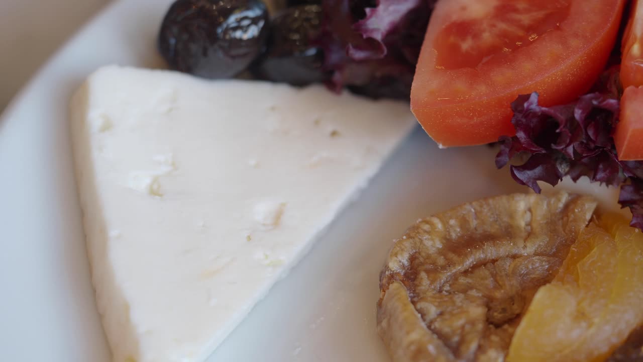 Turkish Breakfast Plate with Cheese, Tomatoes, Figs, and Olives