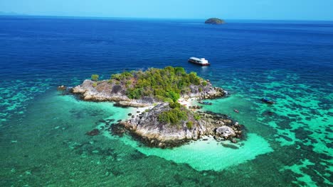 beach rocky cliff island turquoise blue sea