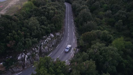 Old-vintage-car-driving-in-the-French-mountains-outside-Monaco