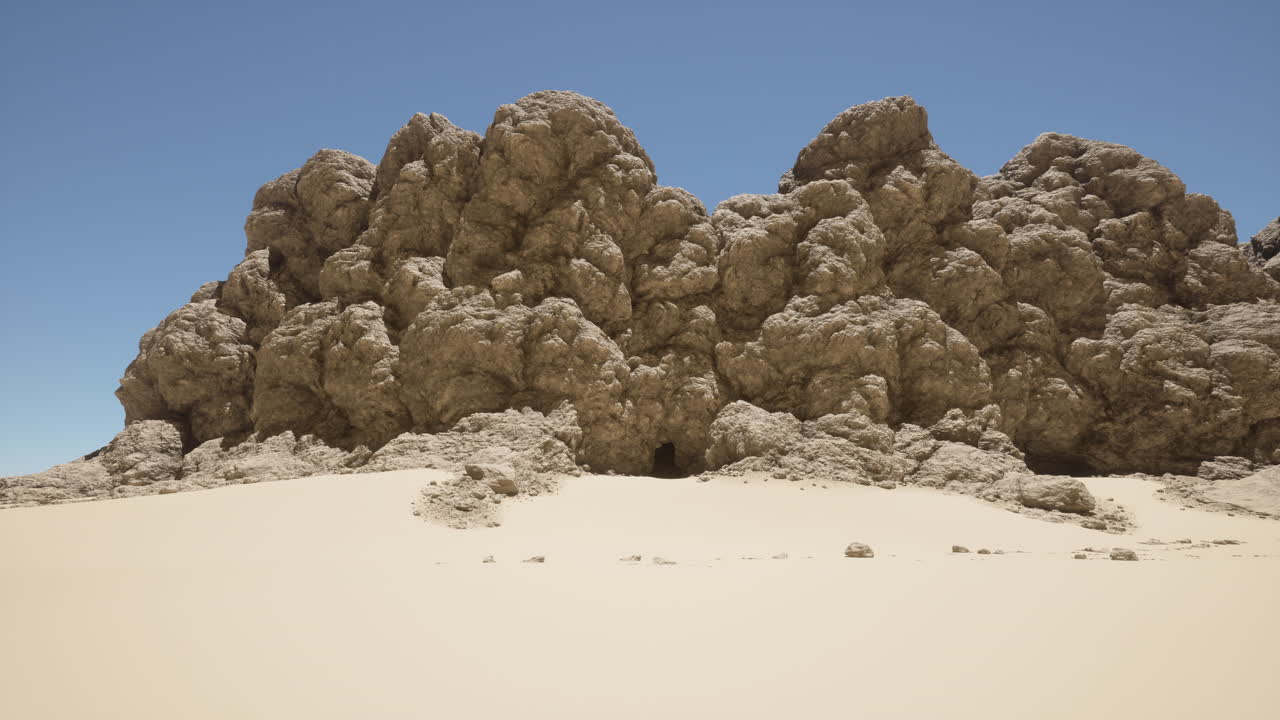 모래 해변 위 에 앉아 있는 바위 들 의 집단