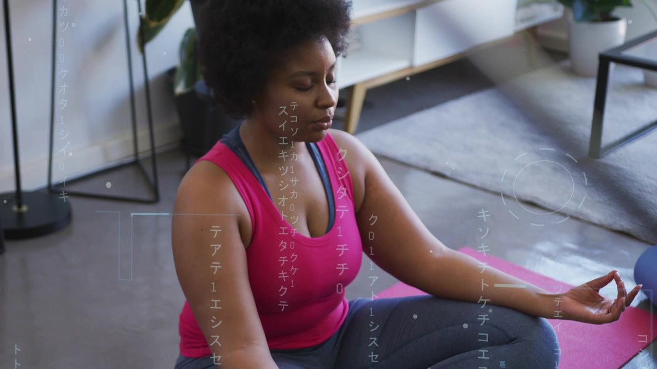 Woman breathing, meditating on pink mat near blue ball, HUD overlay guiding eyes opening for health