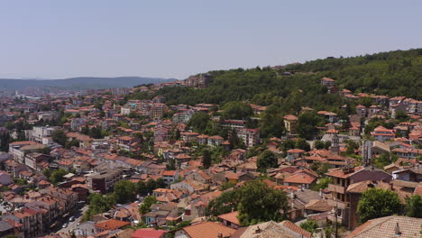 drone descends upon veliko tarnovo historic city built on steep sided hills