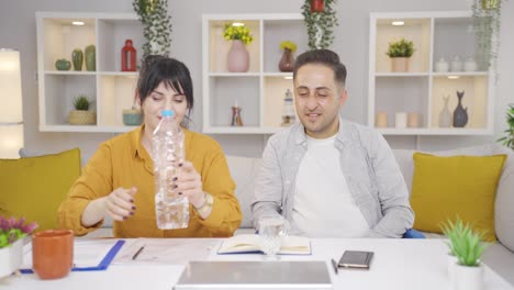 a couple drinking water together.