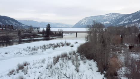 Breathtaking-Winter-Scenery:-Drone-Footage-of-South-Thompson-River-Bridge-and-Little-Shuswap-Lake-in-Chase,-British-Columbia