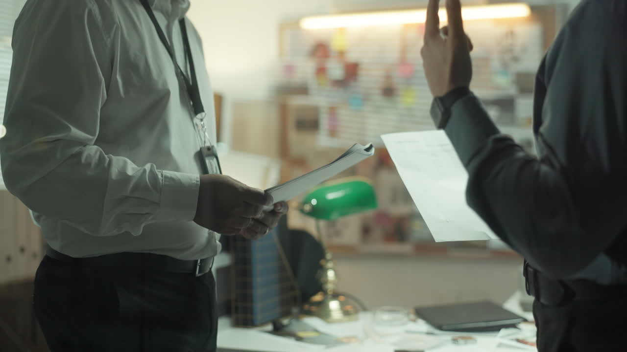 Detectives Discussing a Case in the Office