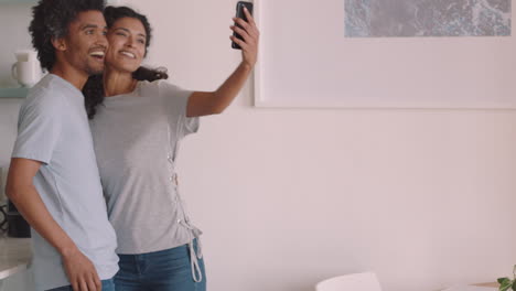 happy young couple dancing at home enjoying funny dance having fun celebrating