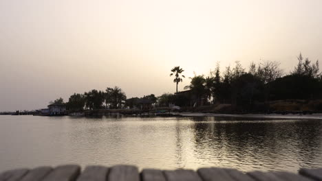 timelapse-in-bassari-country-Senegal-rural-travel-destination-port-pier-dock-with-jungle-background-at-sunset