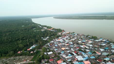 aerial drone view during summer kabong fishing village,with river and beach,sarawak,borneo