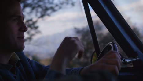 Closeup-of-a-man-driving-an-old-pickup-truck