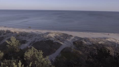 Aerial-drone-zoom-dolly-in-lonely-man-sitting-broken-car-breakdown-beach-waiting-looking-relaxing-meditation-calm-yoga-early-morning-swim-beach-fun-resort-vacation-travel-guide-traveler-summer-waves