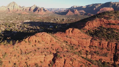 sedona arizona usa, aerial view of homes under red sandstone hills on sunny morning