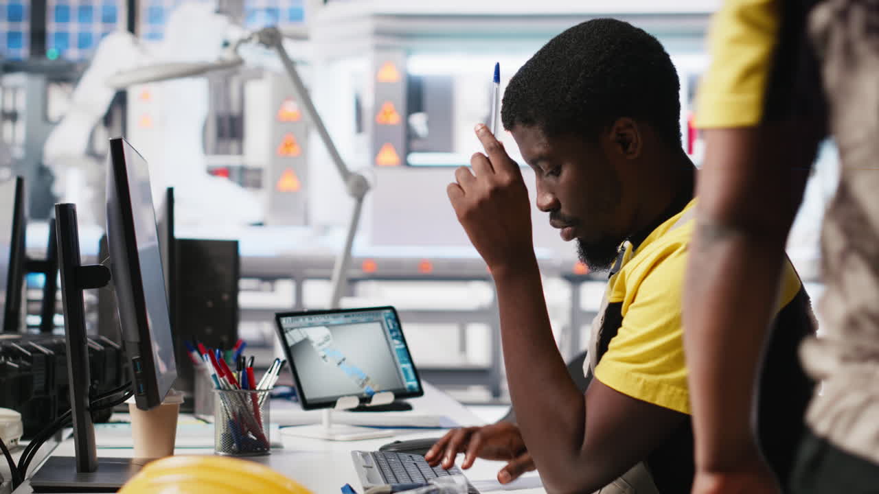 Vertical Video African american technician evaluates renewable energy metrics at pc station