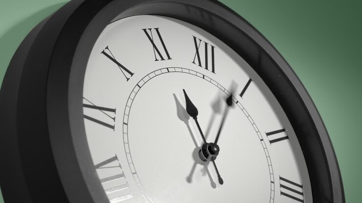 Latin Clock Face on Light Green Wall in Time Lapse