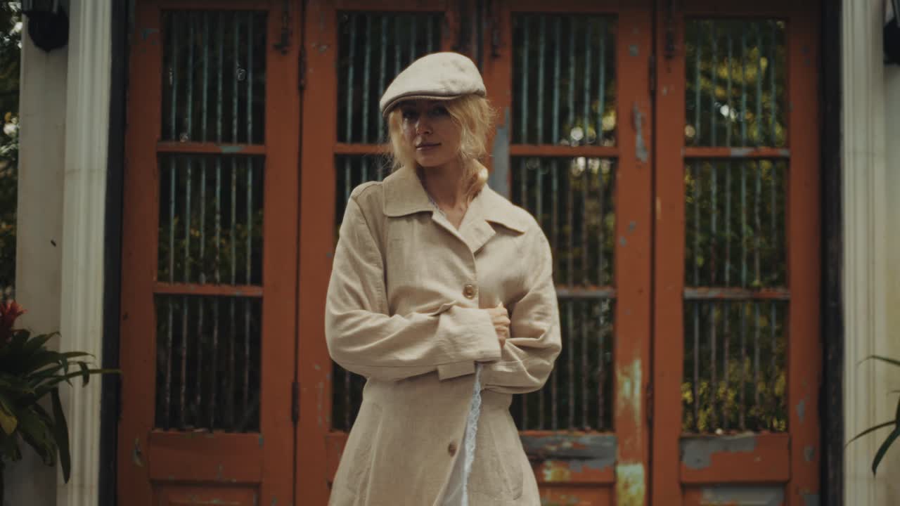 Fashionable woman in front of ornate doors