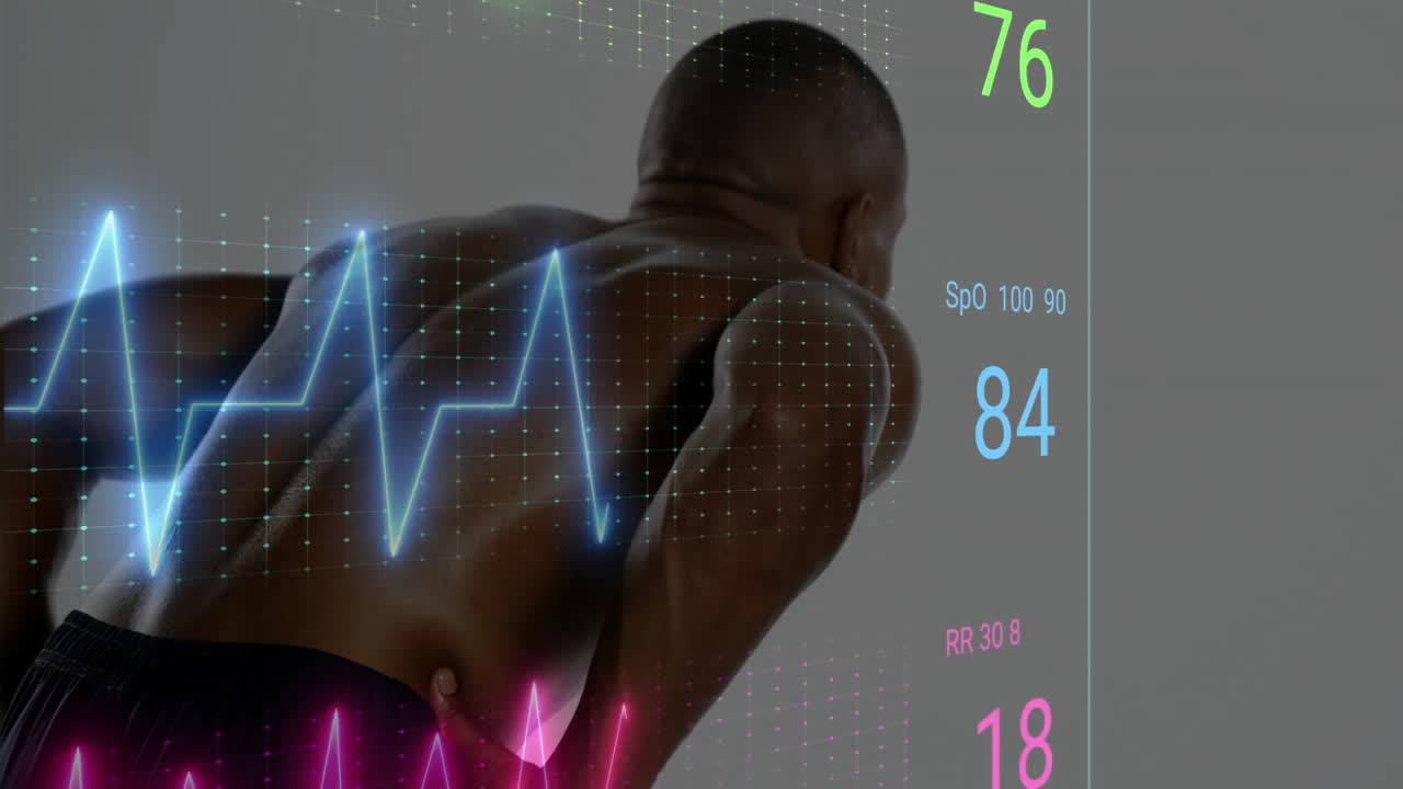 man leaning forward in studio, showing ECG waveform grid, chart, numeric medical stats