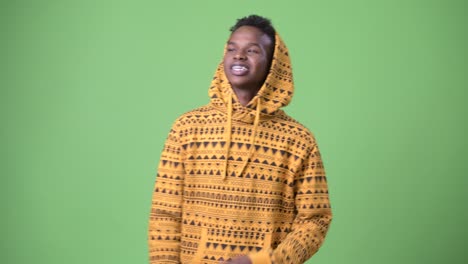 young african man against green background