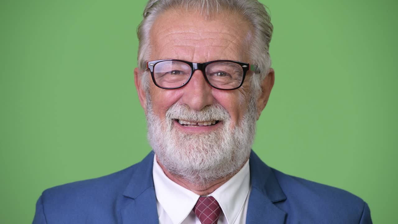 초록색 배경 에 있는 잘생긴 수염 이 있는 상인