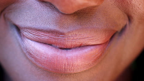 close up of a mouth of a smiling black woman