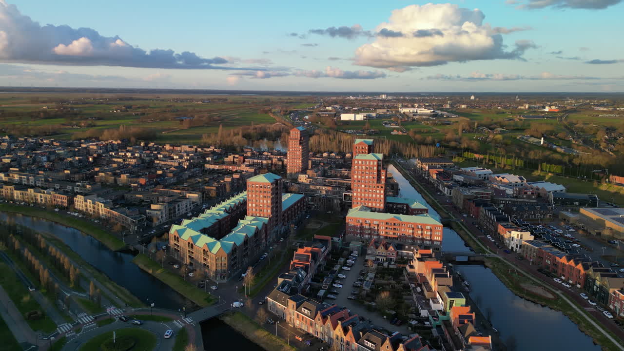 Golden hour with modern buildings at Amersfoort Vathorst, The Netherlands 4K stock video