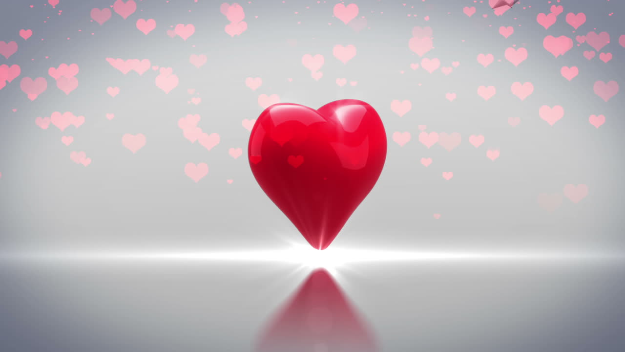 Cuore rosso che gira ed esplode su sfondo grigio