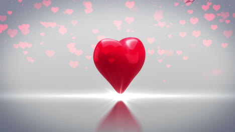 corazón rojo girando y explotando sobre un fondo gris