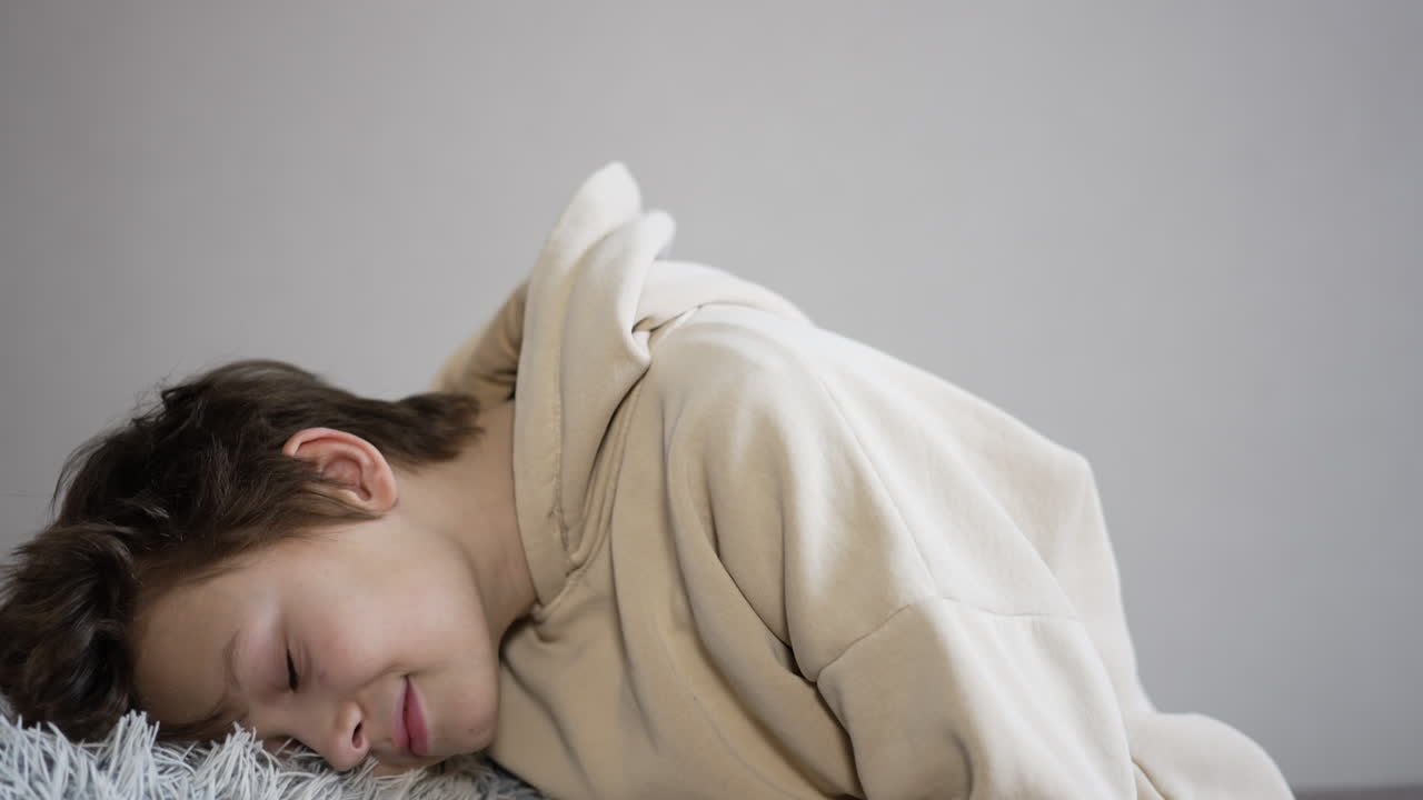Boy Sleeping on a Couch