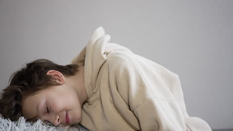 boy sleeping on a couch