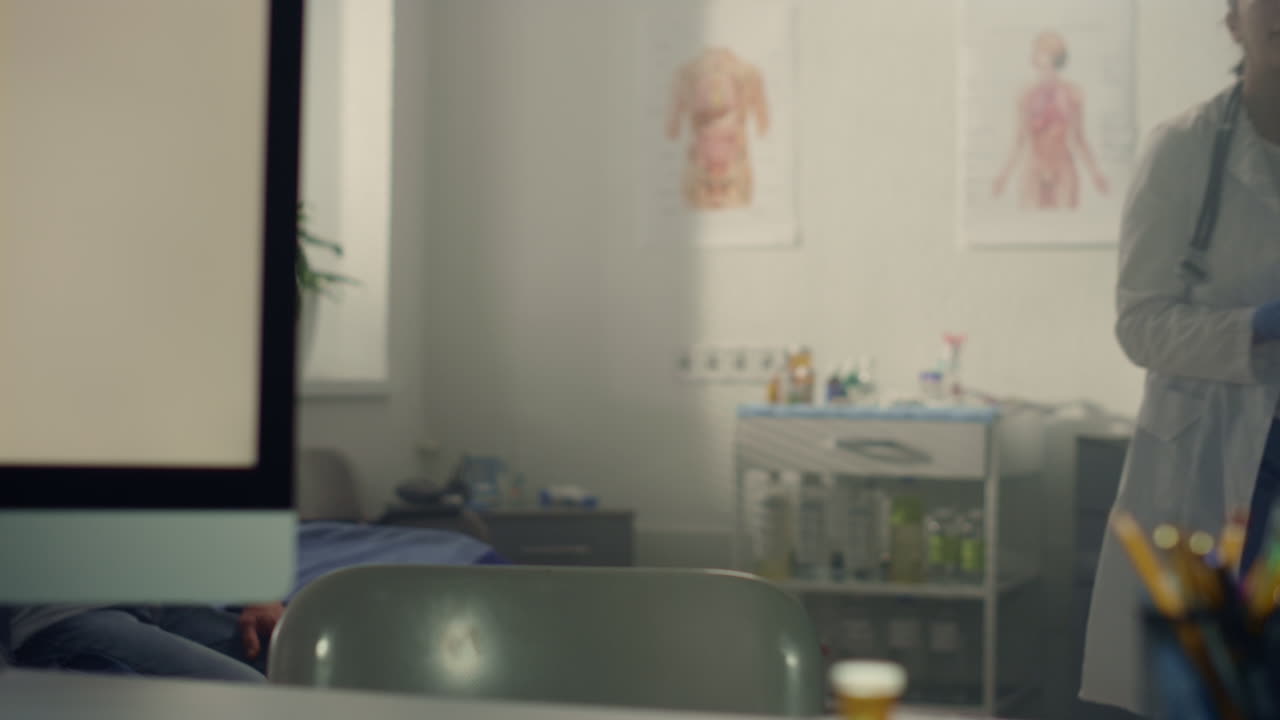 Woman doctor working immunizing elderly people in hospital. Therapist workplace.