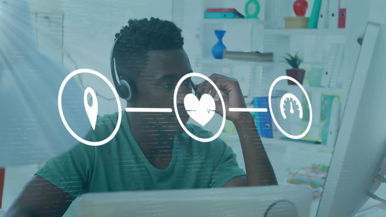 Animation of media icons over african american businessman using phone headset in office