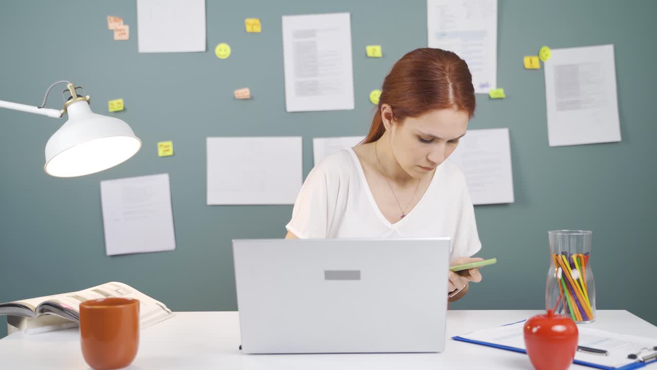 Woman working hard on laptop.
