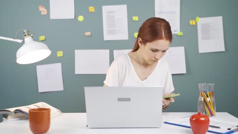 woman working hard on laptop.