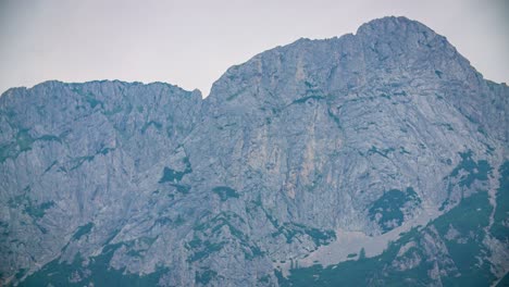 Panning-shot-of-Kanin-Mountains-from-Soca-Valley-in-Slovenia,-from-Slovenian-border-side