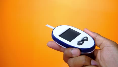 handheld blood glucose meter