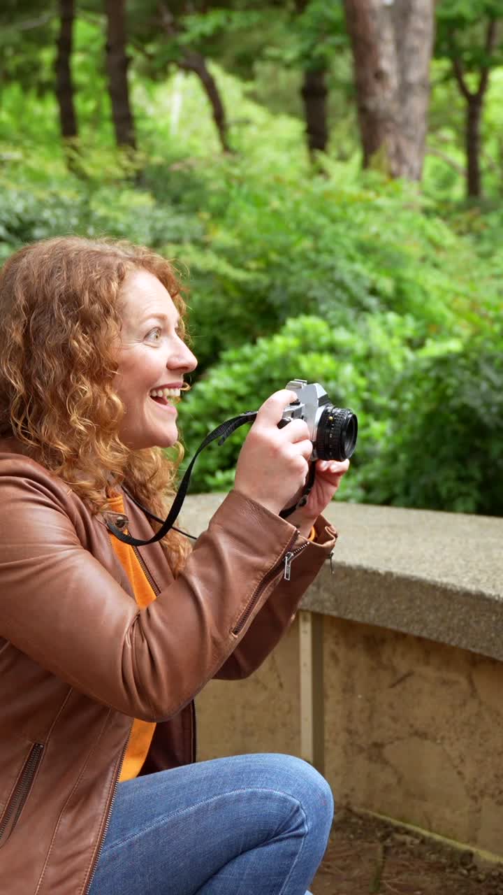 Woman Taking Pictures of Bubbles in the Park