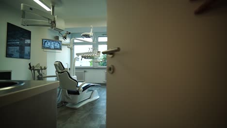 dentist office and dental chair in the middle of the room