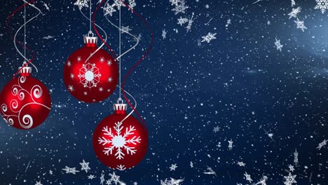 Animation-of-falling-snow-and-christmas-decorations-over-blue-background