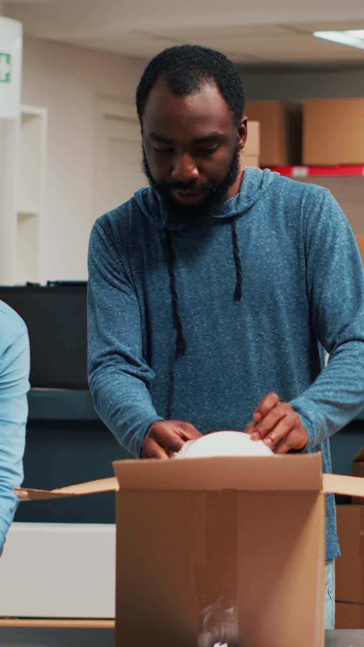 Vertical video: Diverse team of people working on supply chain packaging