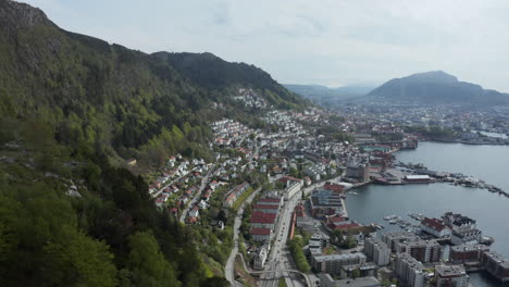 drone shot revealing beautiful sandviken in bergen on a sunny day